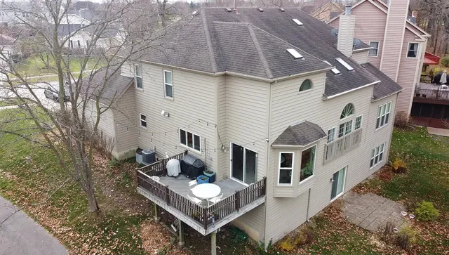 a view of a white house with large windows