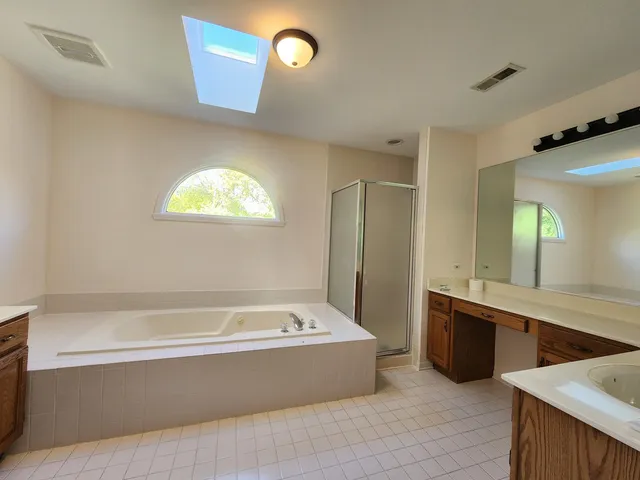 a bathroom with a bathtub and a sink