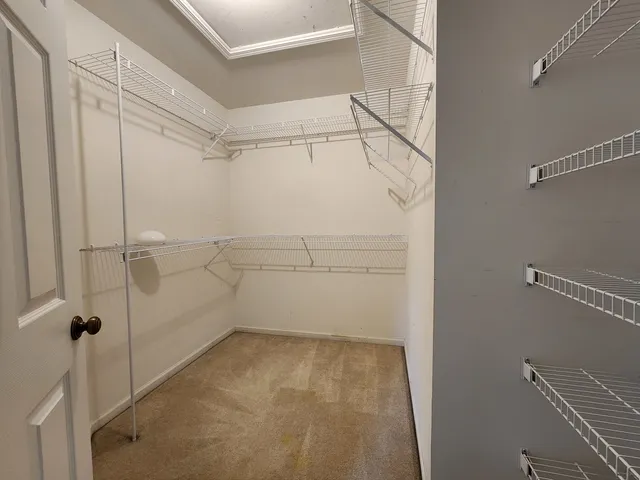 a view of a room with racks on the wall