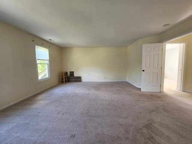 a view of empty room with windows