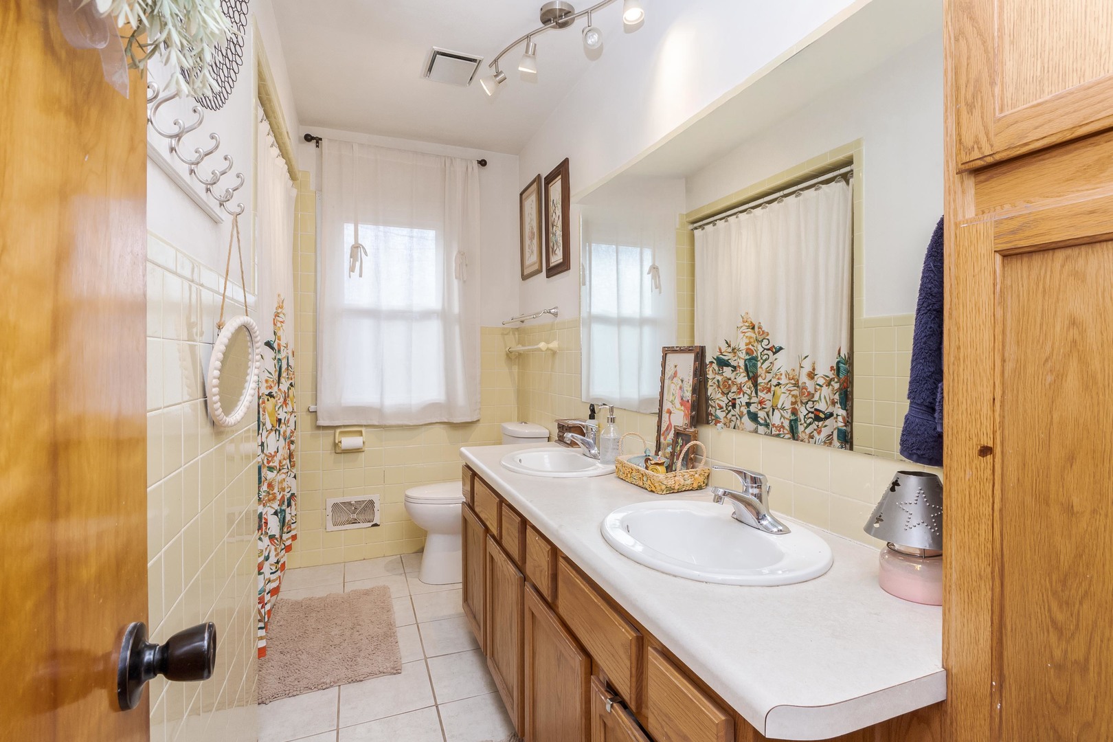 1903 Croxton Avenue Bloomington, IL 61701 - Photo 12 of 55 a bathroom with a sink double vanity and a mirror