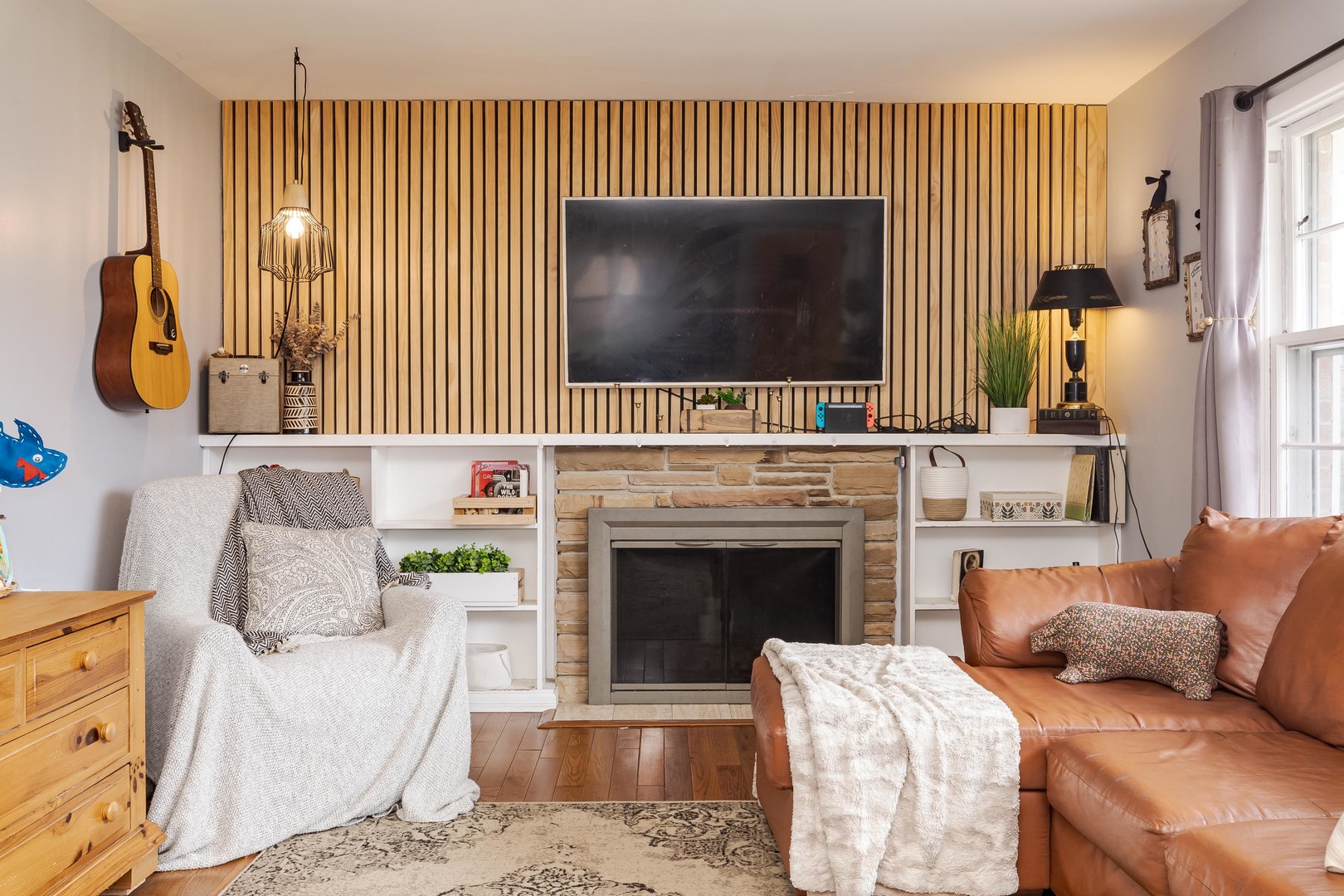 1903 Croxton Avenue Bloomington, IL 61701 - Photo 23 of 55 a living room with furniture a flat screen tv and a fireplace