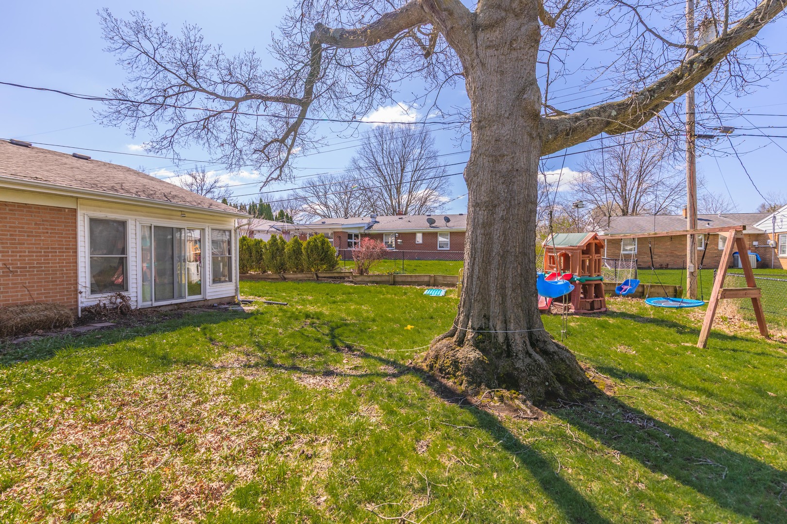 1903 Croxton Avenue Bloomington, IL 61701 - Photo 40 of 55 a view of a house with backyard and a tree