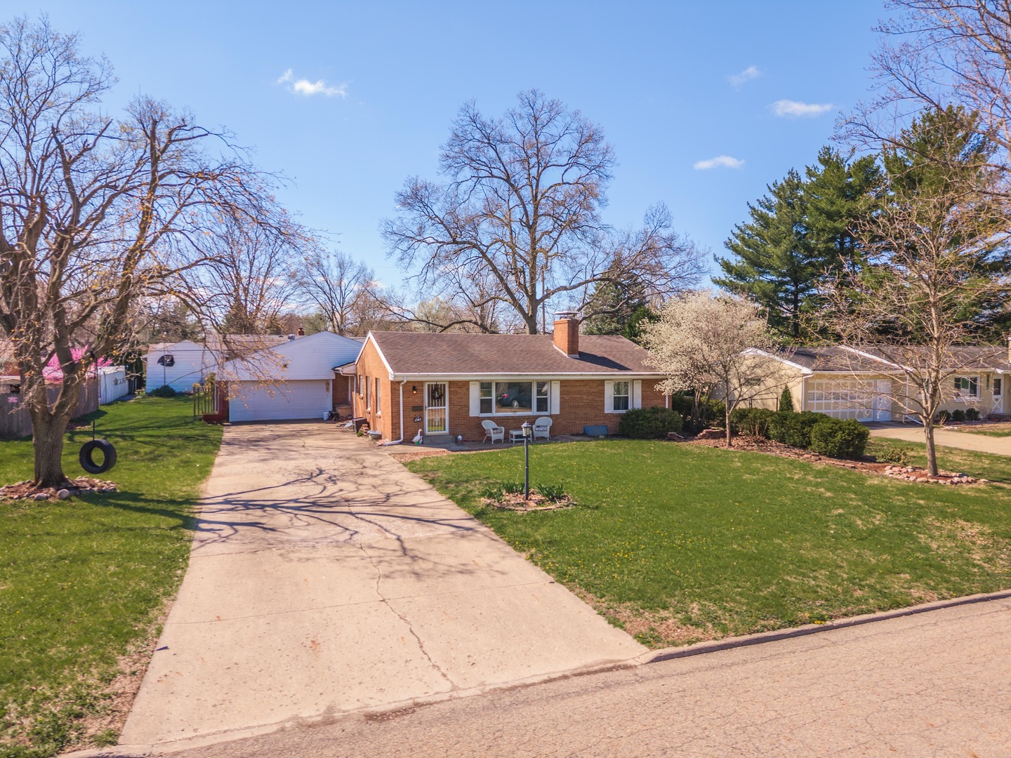 1903 Croxton Avenue Bloomington, IL 61701 - Photo 43 of 55 a front view of a house with a garden and trees
