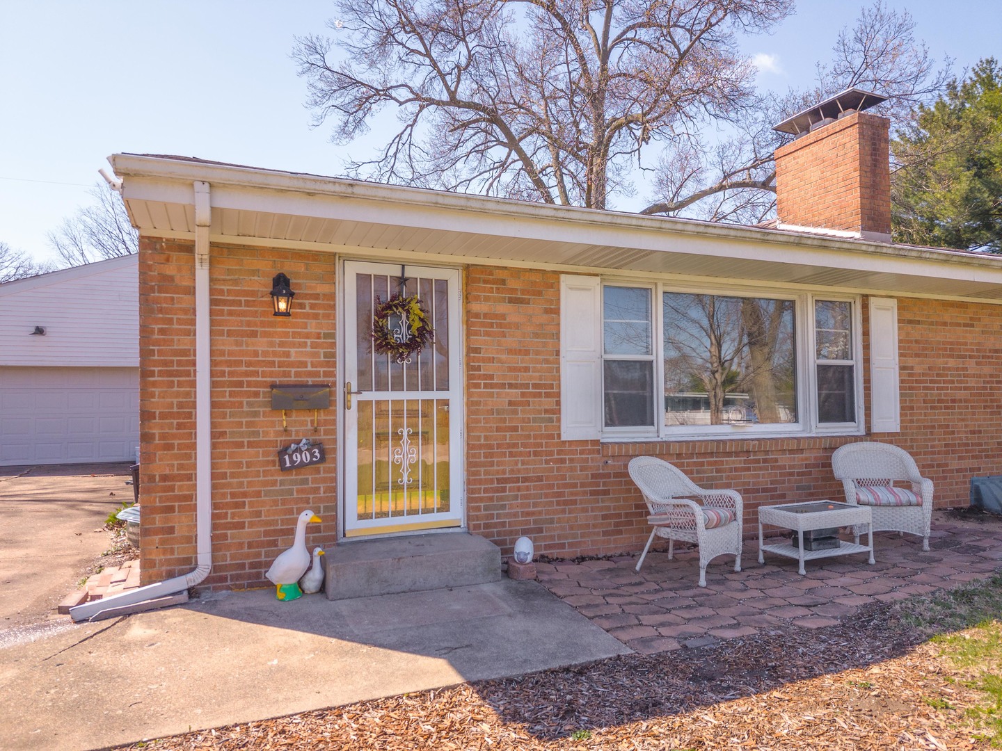 1903 Croxton Avenue Bloomington, IL 61701 - Photo 49 of 55 a front view of a house with outdoor seating