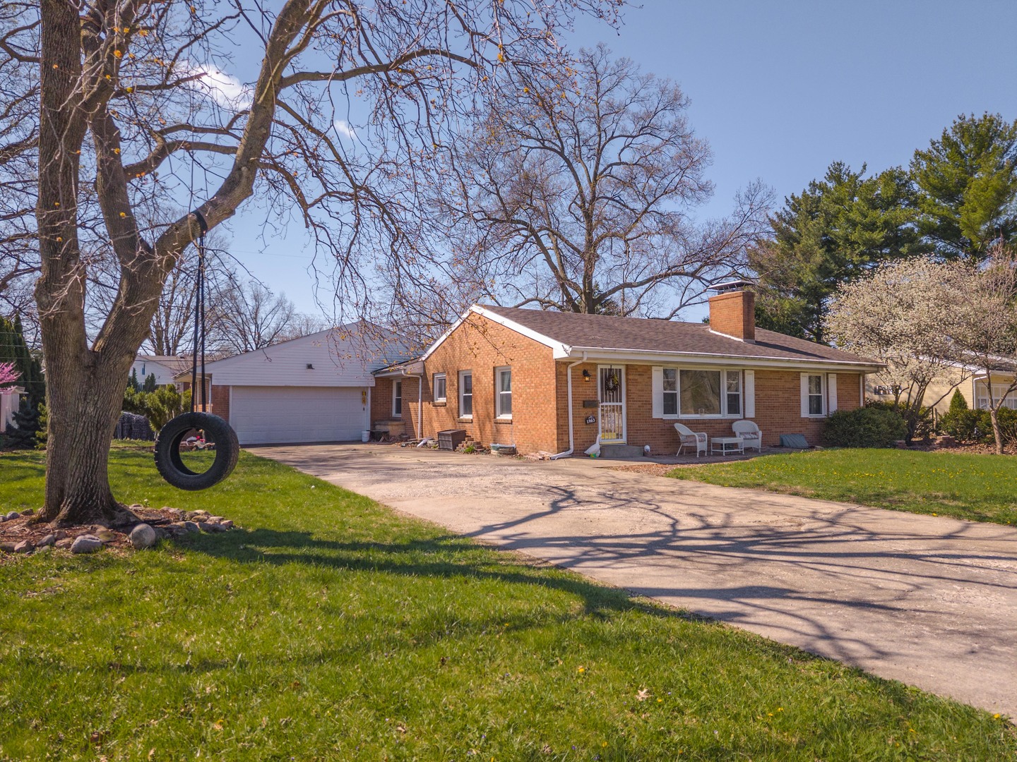 1903 Croxton Avenue Bloomington, IL 61701 - Photo 50 of 55 a front view of a house with a garden and trees