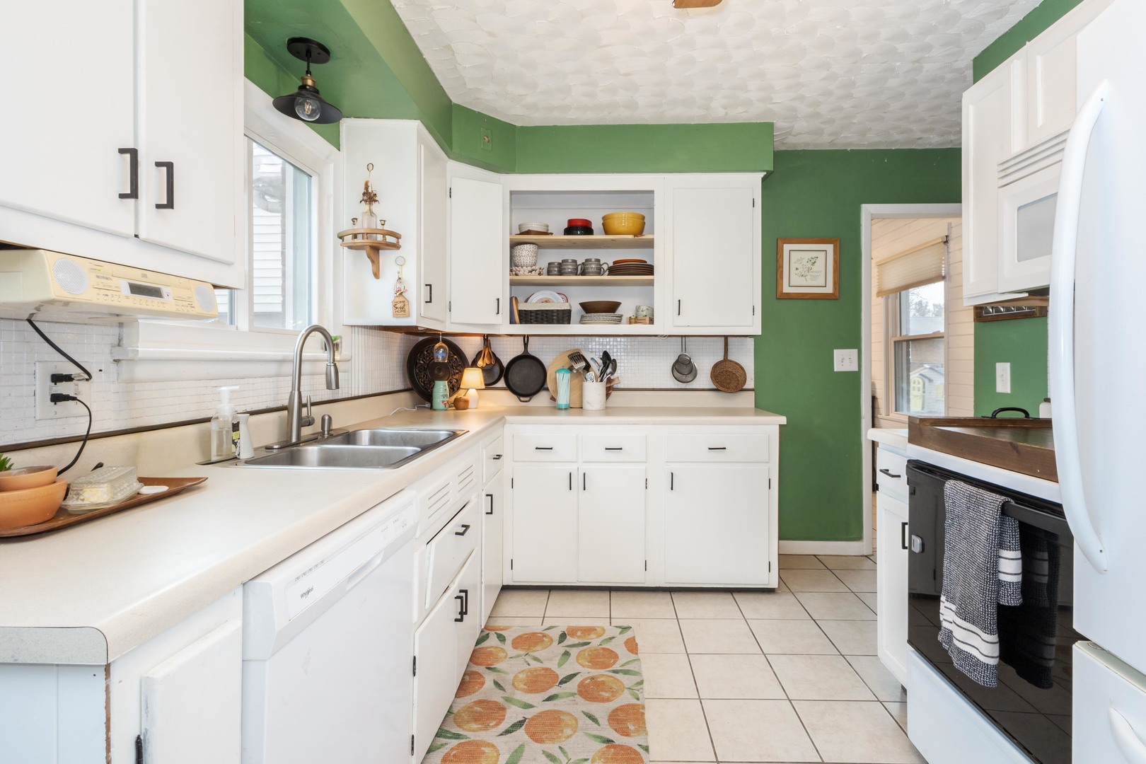 1903 Croxton Avenue Bloomington, IL 61701 - Photo 5 of 55 a kitchen with a sink stove and cabinets