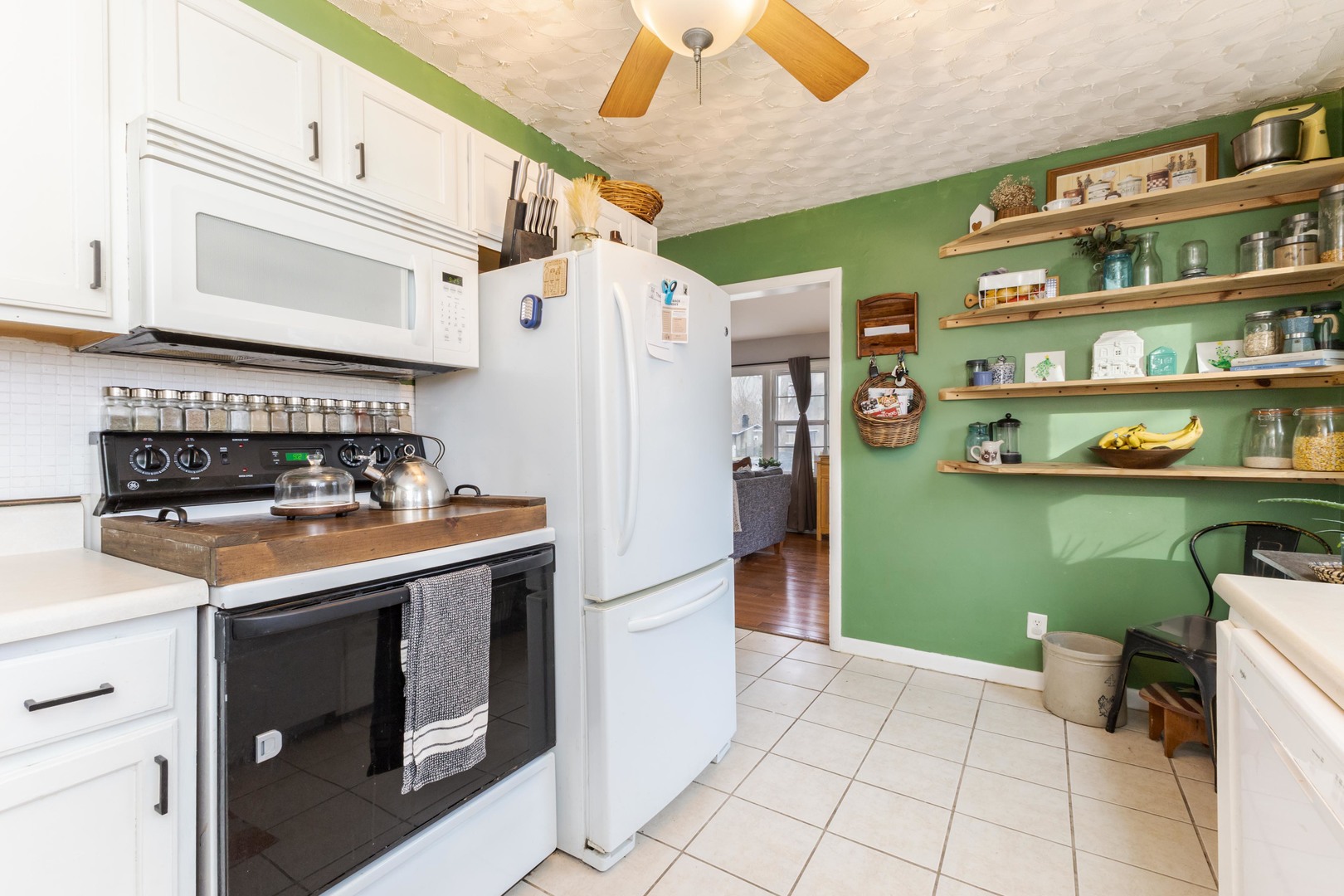 1903 Croxton Avenue Bloomington, IL 61701 - Photo 7 of 55 a kitchen with a refrigerator and a stove top oven