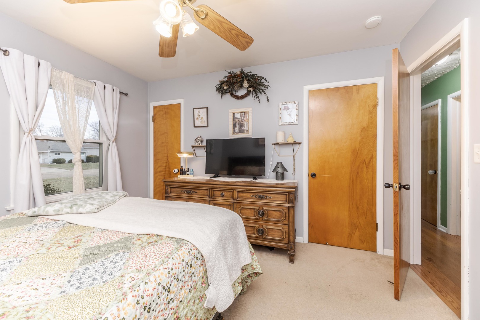 1903 Croxton Avenue Bloomington, IL 61701 - Photo 9 of 55 a bedroom with a bed and a flat screen tv