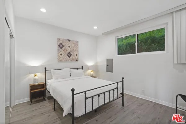 a bedroom with a bed and a table