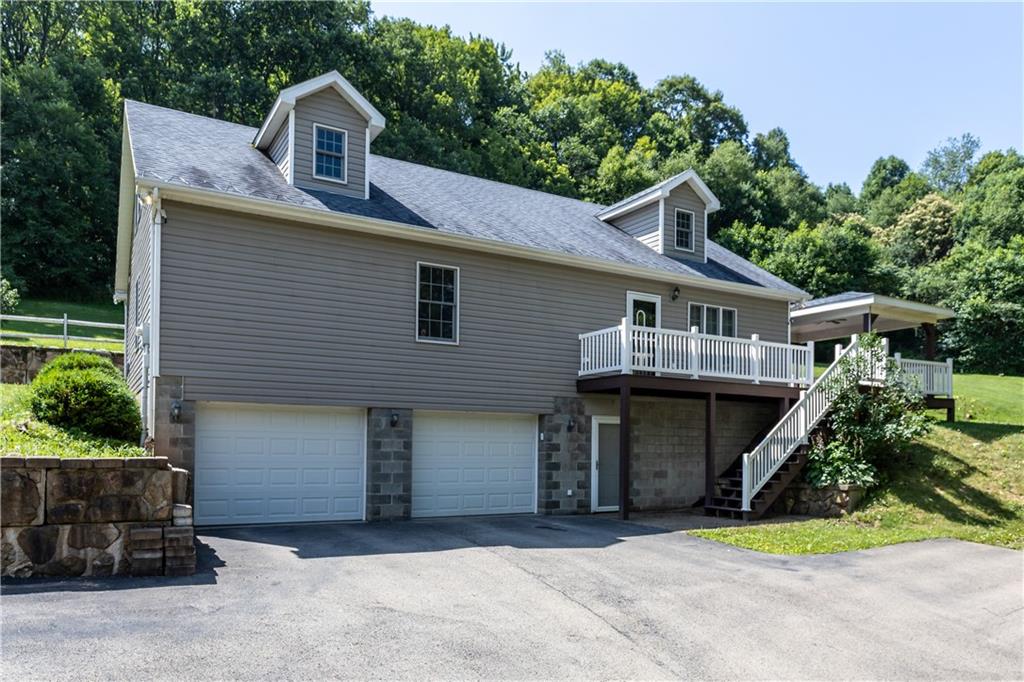 509 Quail Hill Road Normalville, PA 15469 - Photo 1 of 26 a front view of a house with a yard