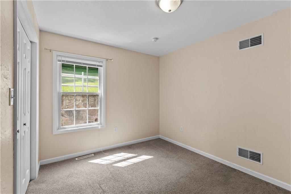 509 Quail Hill Road Normalville, PA 15469 - Photo 12 of 26 an empty room with a window