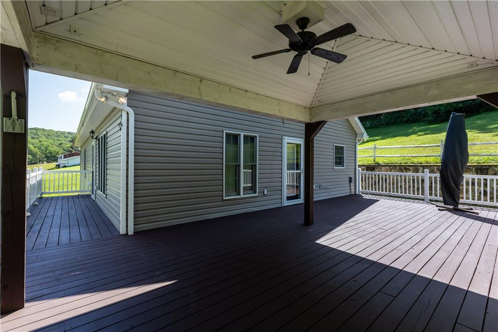 509 Quail Hill Road Normalville, PA 15469 - Photo 2 of 26 a view of outdoor space with wooden floor and a ceiling fan