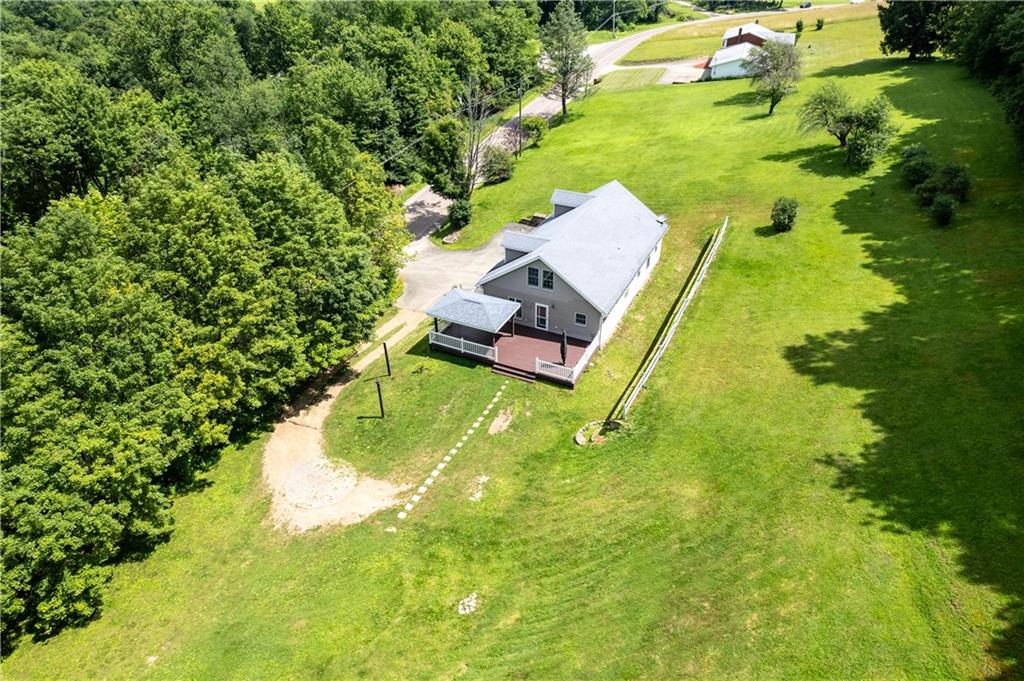509 Quail Hill Road Normalville, PA 15469 - Photo 23 of 26 a swimming pool with some trees in the background
