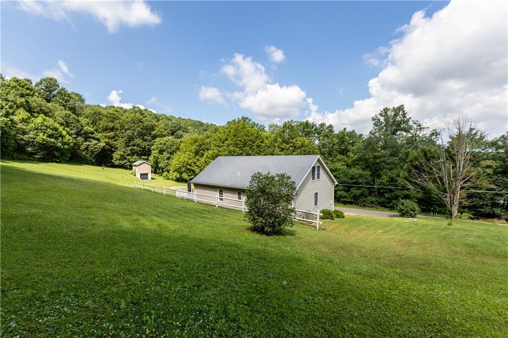 509 Quail Hill Road Normalville, PA 15469 - Photo 25 of 26 a view of a house with a backyard