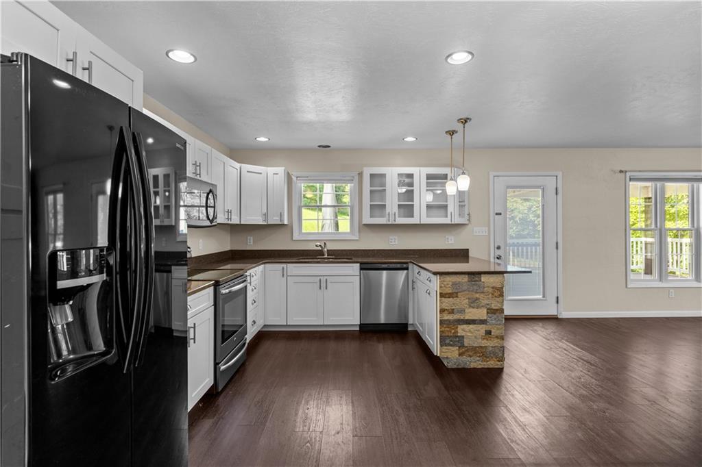509 Quail Hill Road Normalville, PA 15469 - Photo 7 of 26 a kitchen with stainless steel appliances a refrigerator sink and cabinets