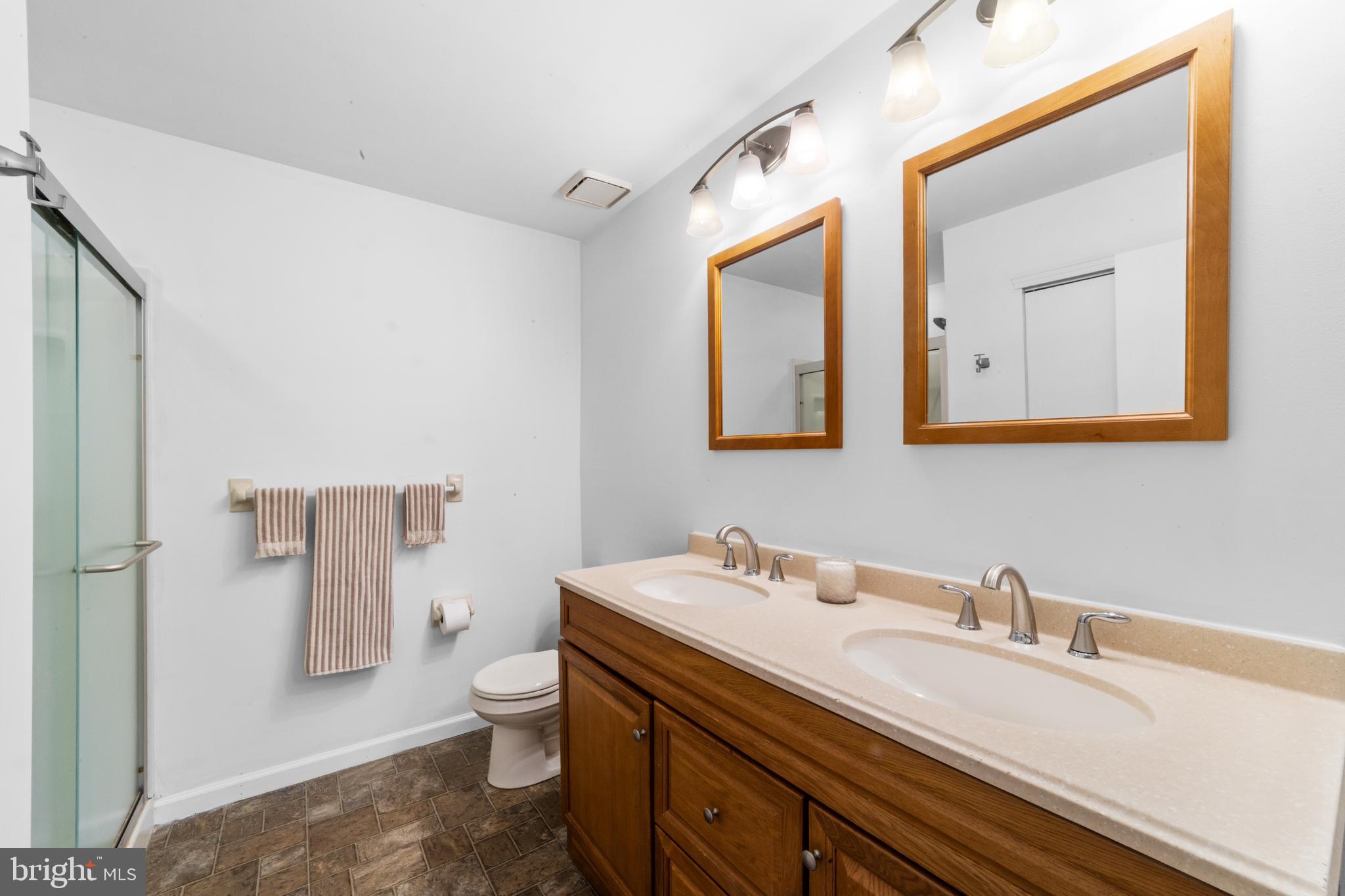1202 Augusta Circle Mount Laurel, NJ 08054 - Photo 12 of 25 a bathroom with a sink a toilet and mirror