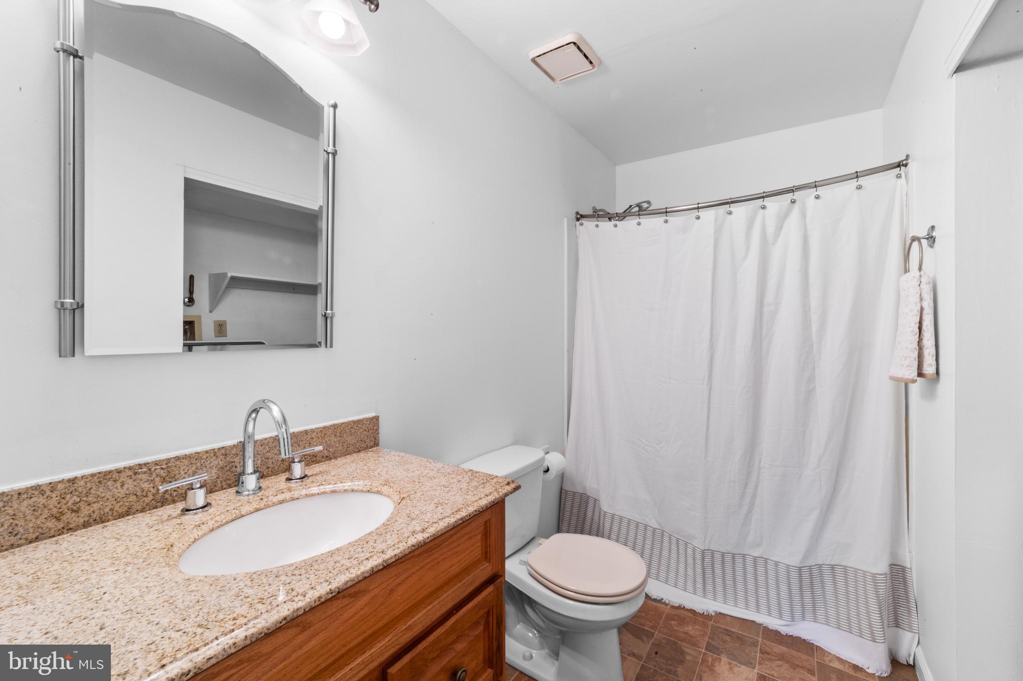 1202 Augusta Circle Mount Laurel, NJ 08054 - Photo 17 of 25 a bathroom with a granite countertop sink and a mirror