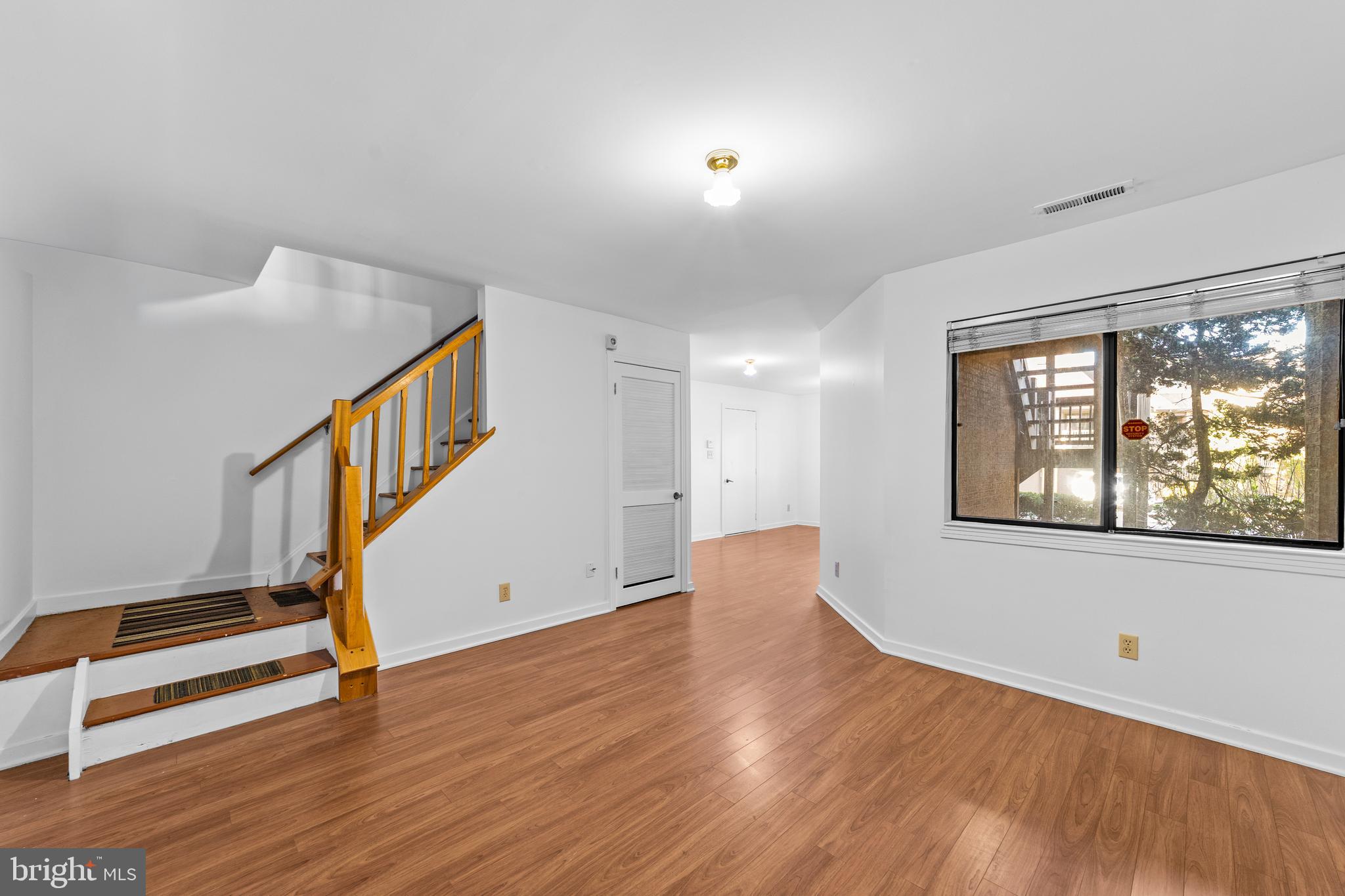 1202 Augusta Circle Mount Laurel, NJ 08054 - Photo 19 of 25 wooden floor in an empty room with a window