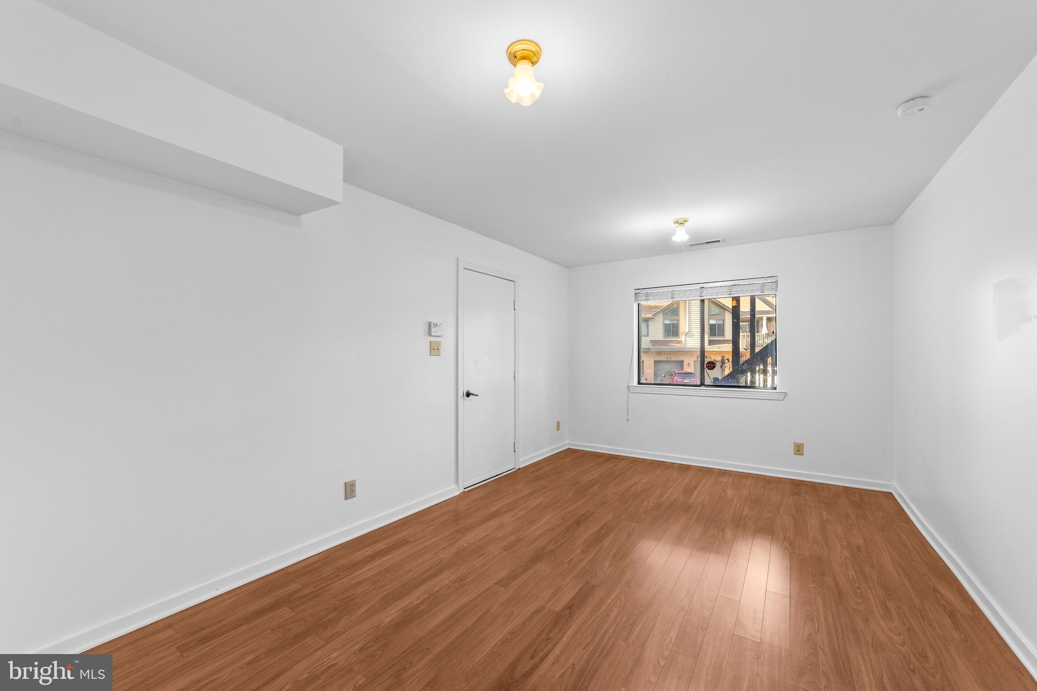 1202 Augusta Circle Mount Laurel, NJ 08054 - Photo 20 of 25 a view of empty room with wooden floor and fan