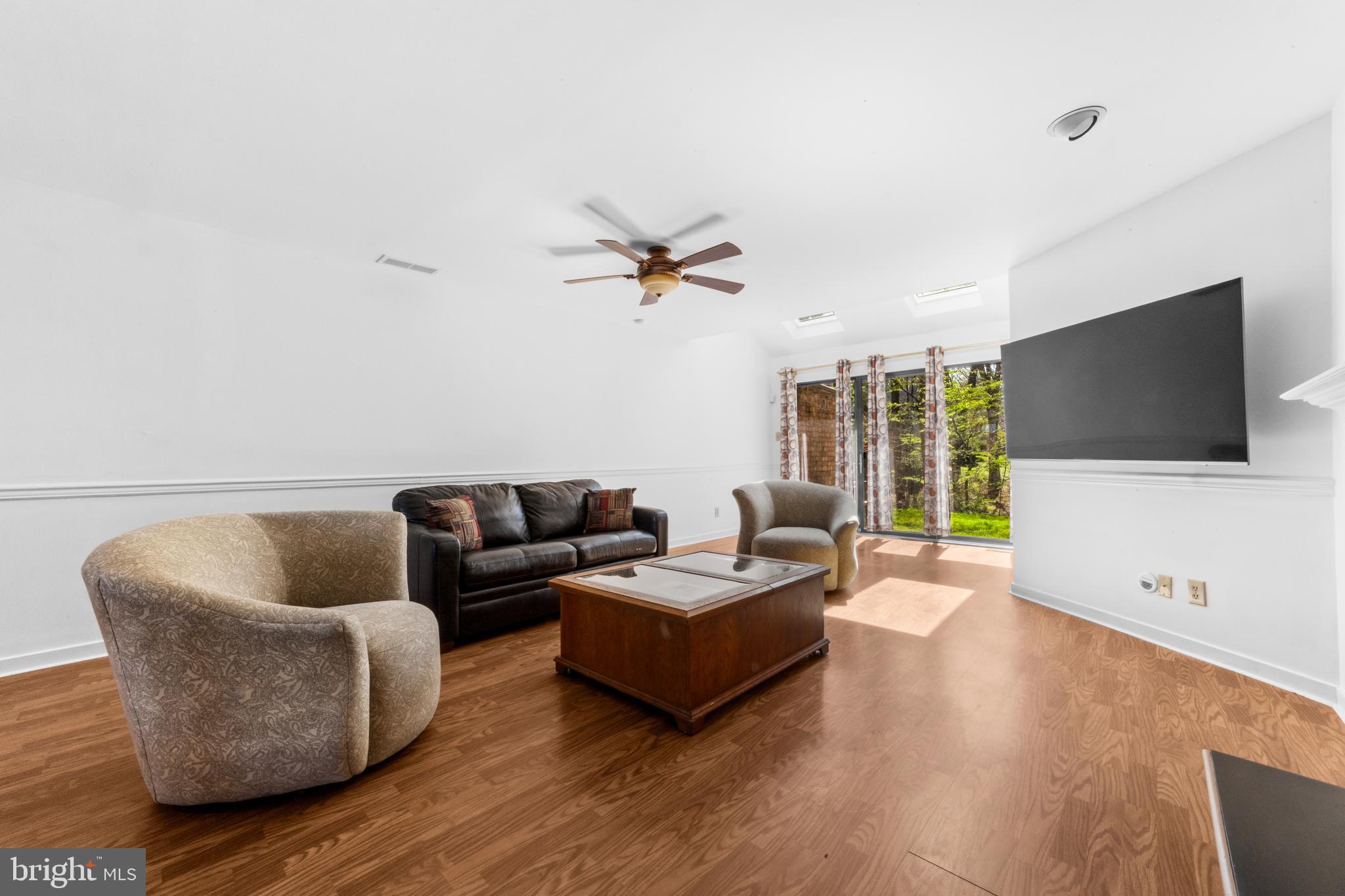 1202 Augusta Circle Mount Laurel, NJ 08054 - Photo 5 of 25 a living room with furniture ceiling fan and a flat screen tv