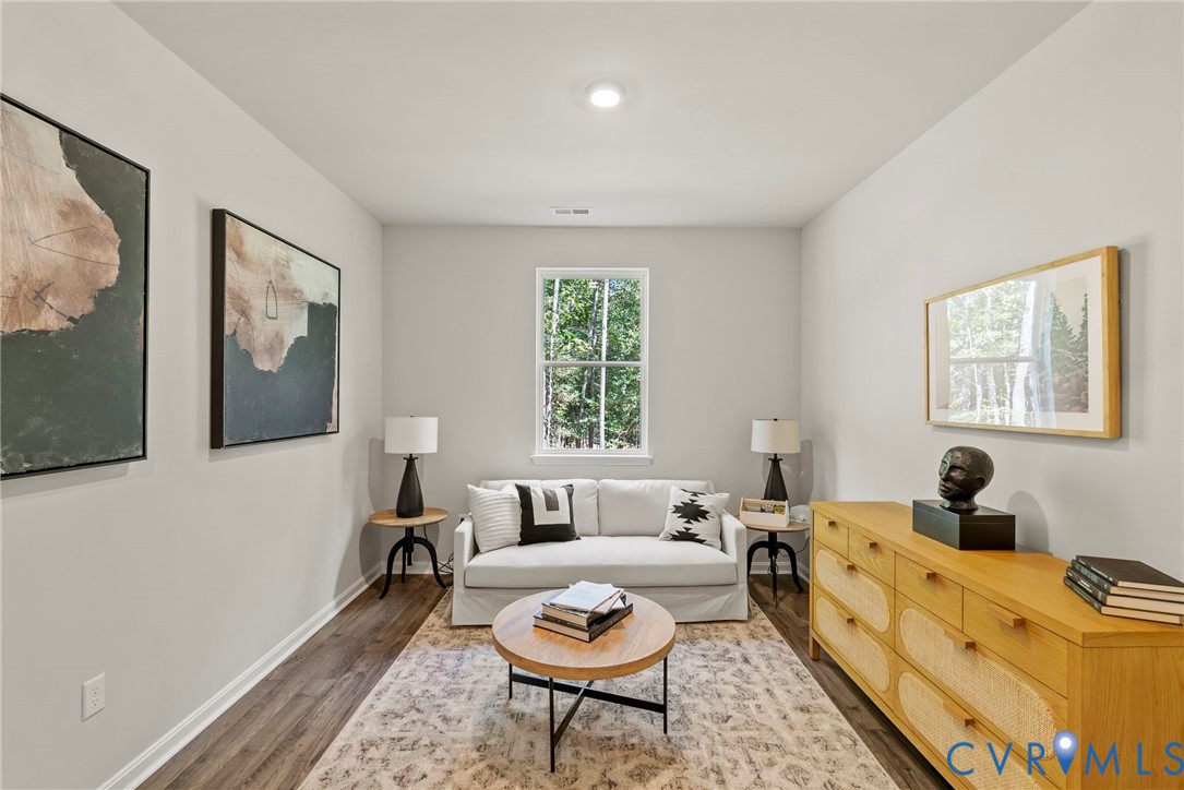 7745 Arbor Marsh Terrace New Kent, VA 23124 - Photo 7 of 30 a living room with furniture two window and a lamp