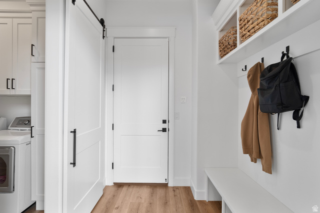 2278 Tawny Ridge Circle St. George, UT 84790 - Photo 20 of 61 Entryway featuring built-in bench seating, upper open shelving, and coat hooks.