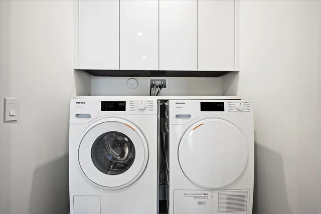 a view of washer and dryer with kitchen countertop