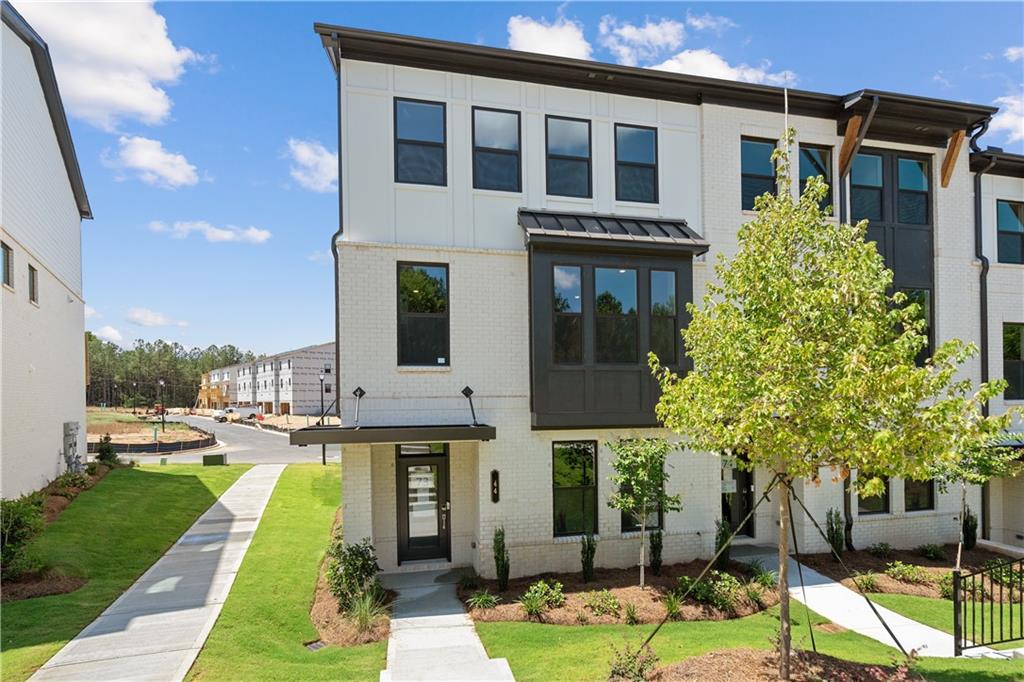 44 Peeples Drive Lawrenceville, GA 30046 - Photo 1 of 1 a front view of a house with garden