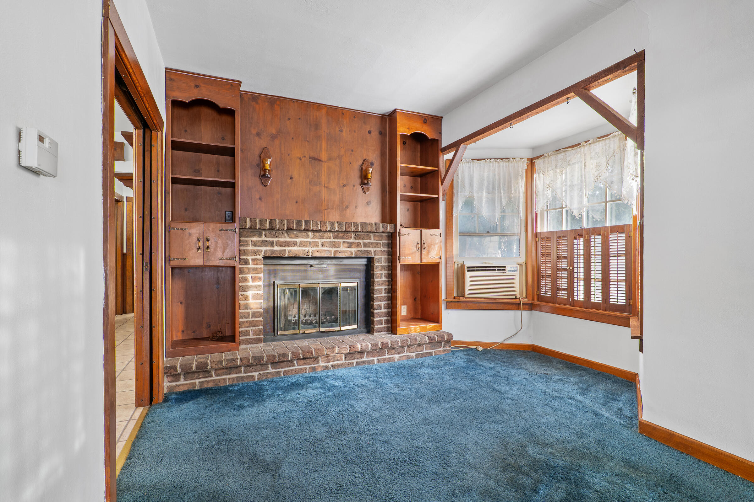 851 North 10th Street Manitowoc, WI 54220 - Photo 8 of 39 The natural fireplace and mantal are such a showcase feature!