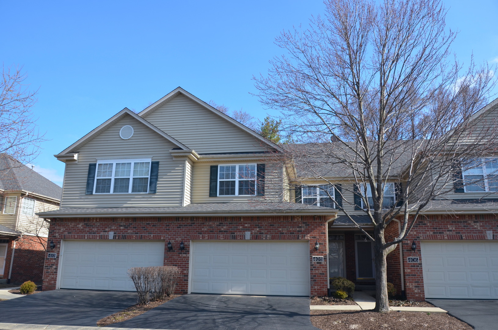 408 North River Road, Unit 408 Naperville, IL 60540 - Photo 1 of 36 a front view of a house with garage