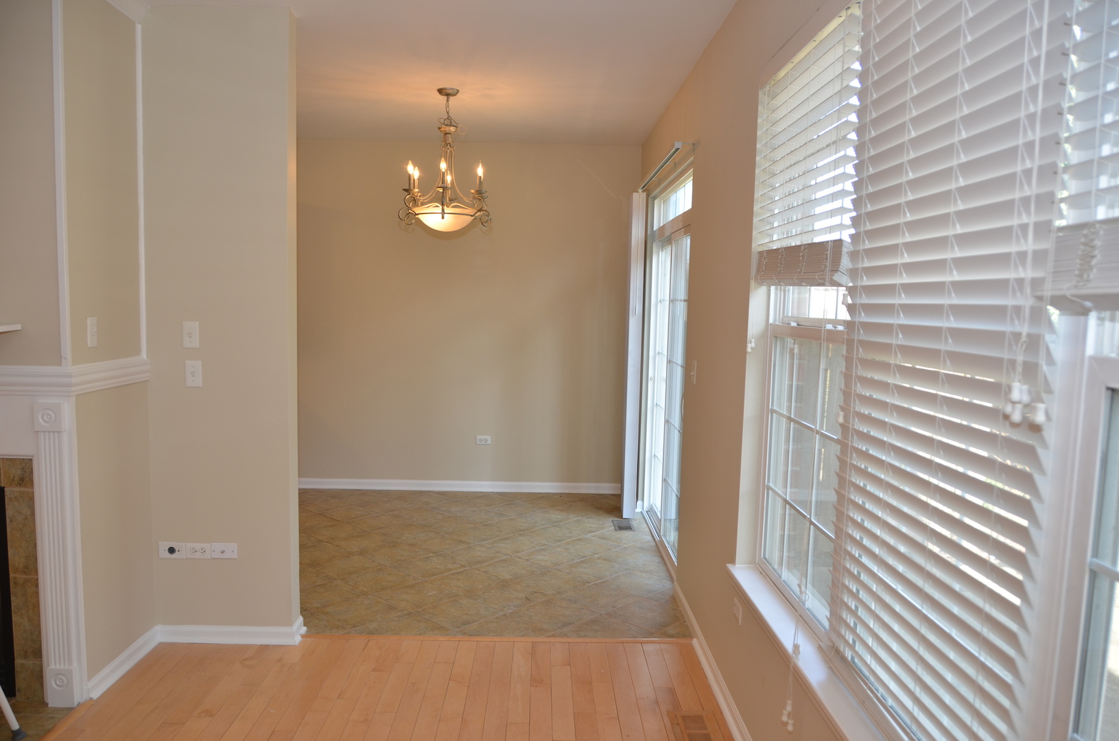 408 North River Road, Unit 408 Naperville, IL 60540 - Photo 13 of 36 en view of a room with wooden floor and chandelier