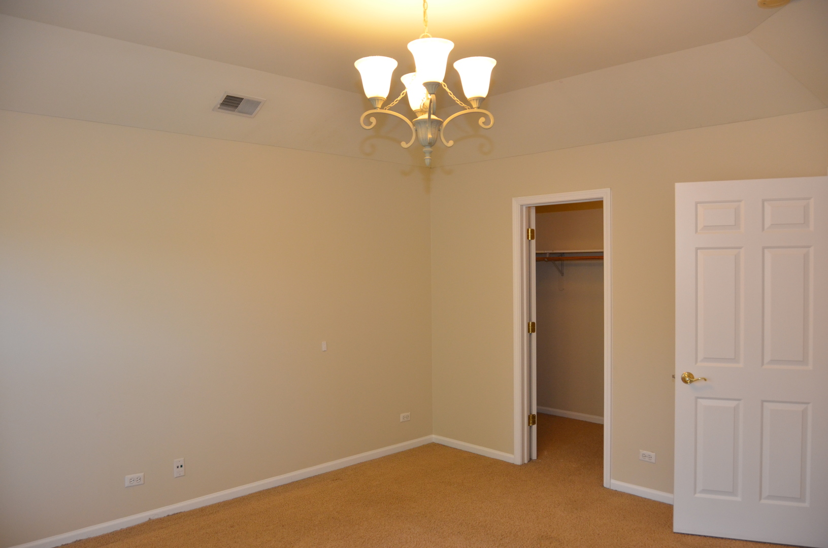 408 North River Road, Unit 408 Naperville, IL 60540 - Photo 16 of 36 a view of a chandelier fan and wooden floor