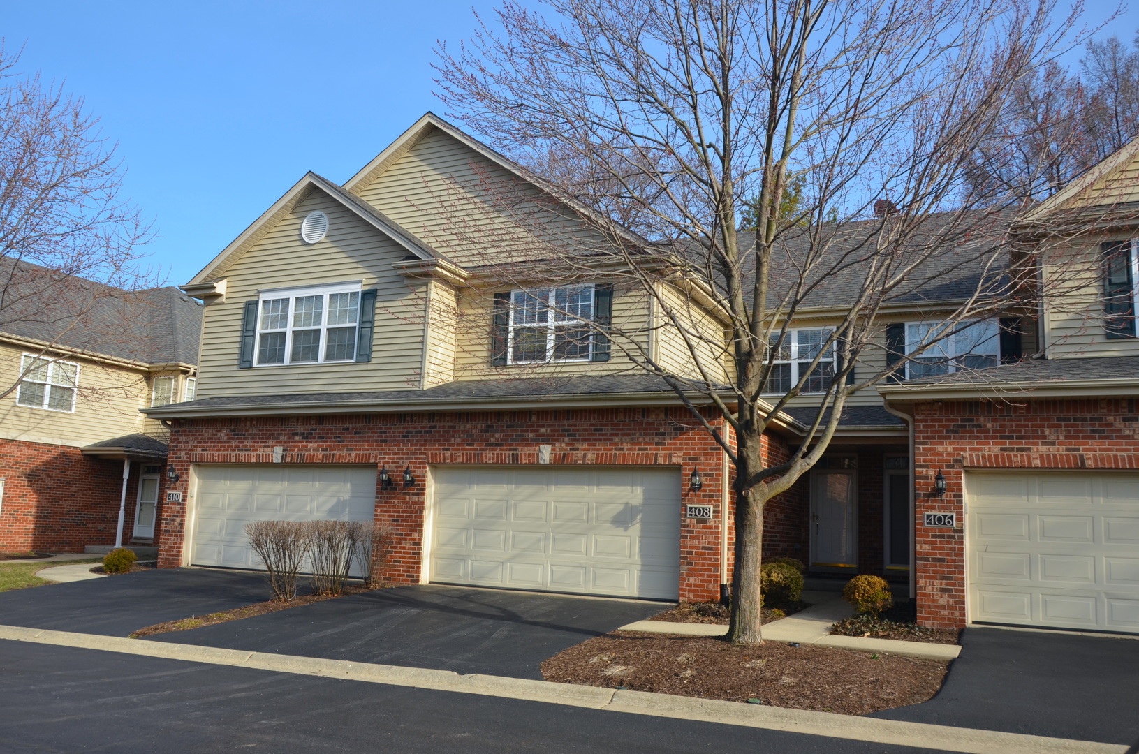 408 North River Road, Unit 408 Naperville, IL 60540 - Photo 3 of 36 front view of a house with a street
