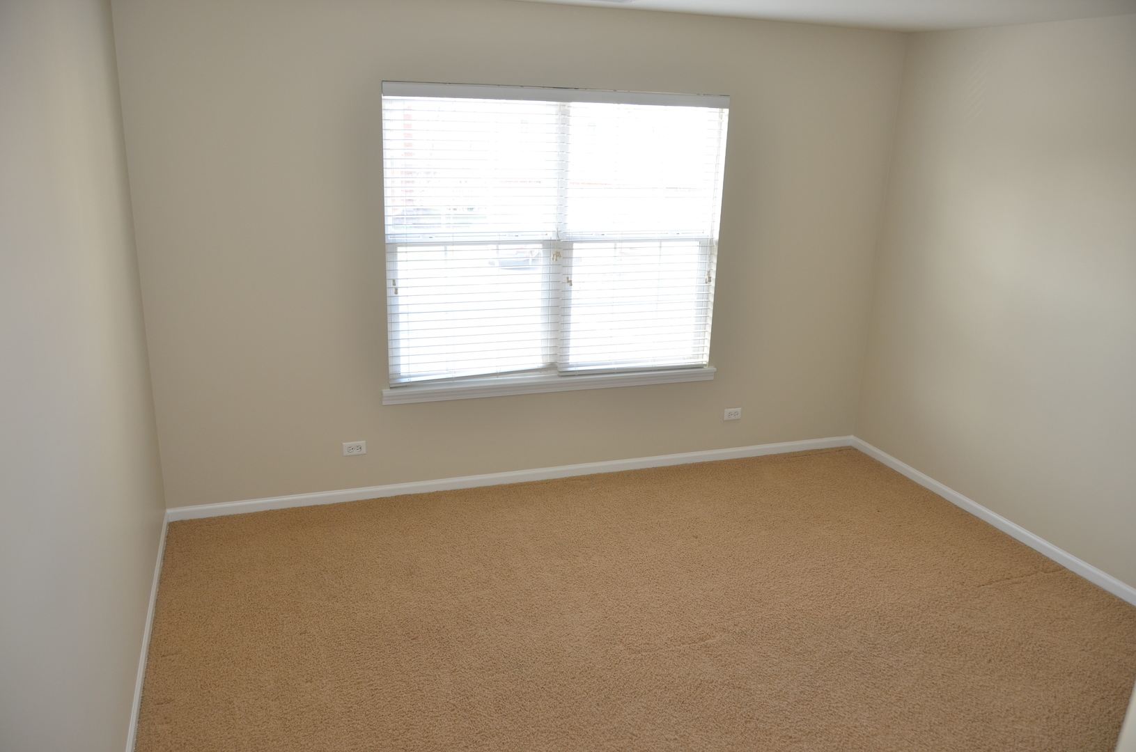 408 North River Road, Unit 408 Naperville, IL 60540 - Photo 21 of 36 an empty room with a window
