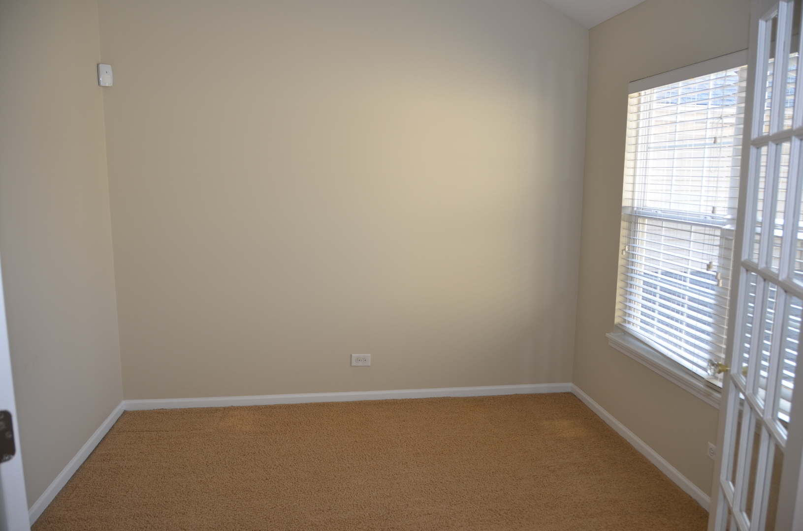 408 North River Road, Unit 408 Naperville, IL 60540 - Photo 24 of 36 a view of an empty room with a window