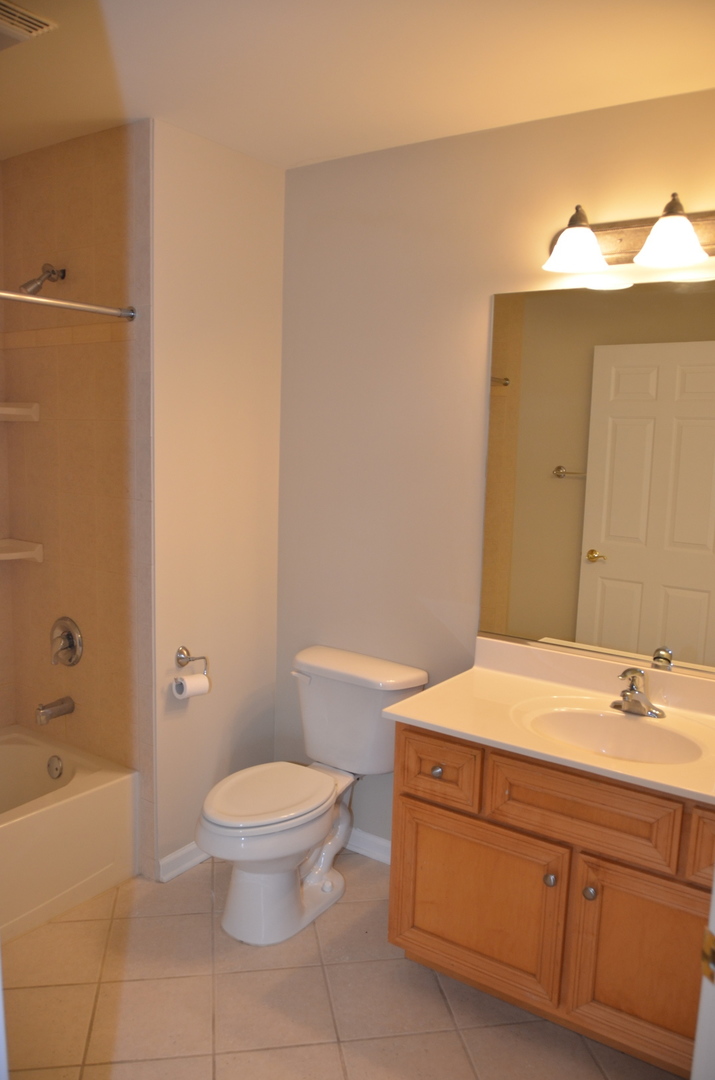 408 North River Road, Unit 408 Naperville, IL 60540 - Photo 27 of 36 a bathroom with a sink and a toilet