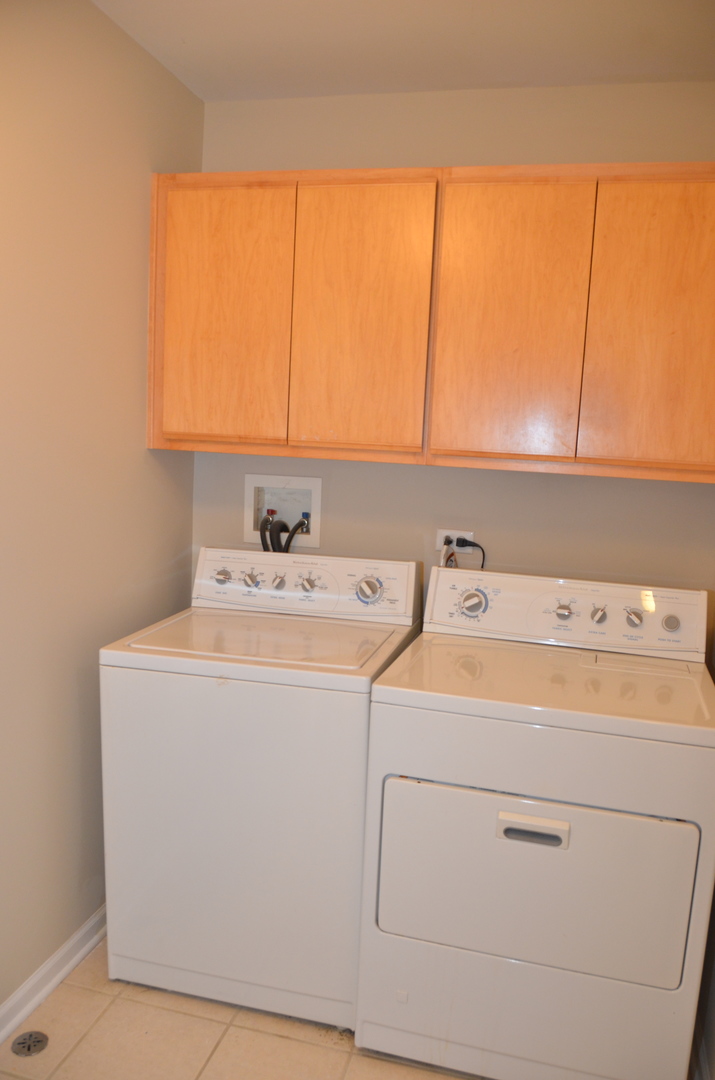 408 North River Road, Unit 408 Naperville, IL 60540 - Photo 28 of 36 a utility room with dryer and washer