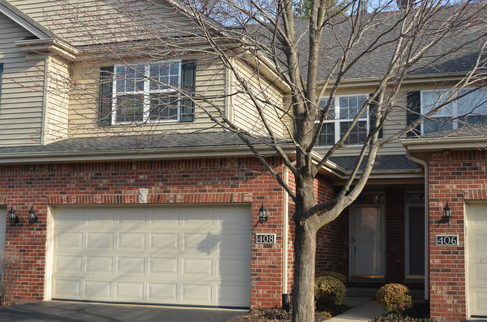 408 North River Road, Unit 408 Naperville, IL 60540 - Photo 4 of 36 a front view of a house with a tree