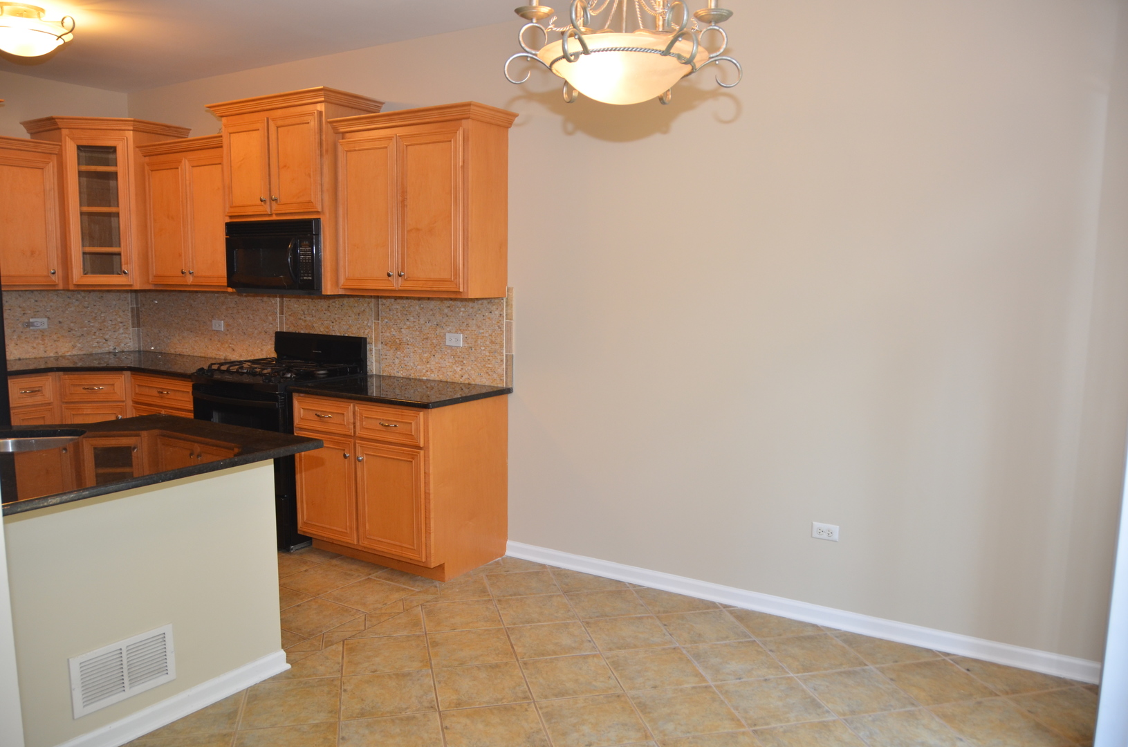 408 North River Road, Unit 408 Naperville, IL 60540 - Photo 7 of 36 a kitchen with stainless steel appliances granite countertop a sink and a stove