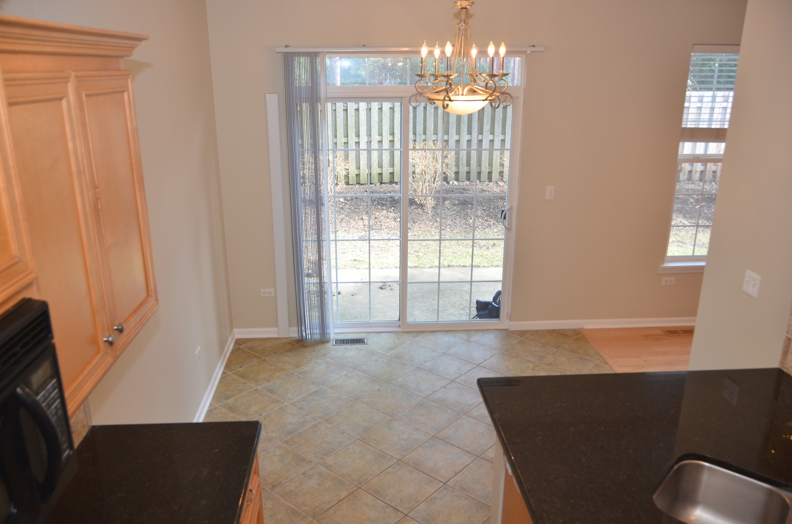 408 North River Road, Unit 408 Naperville, IL 60540 - Photo 8 of 36 a view of an empty room with glass door