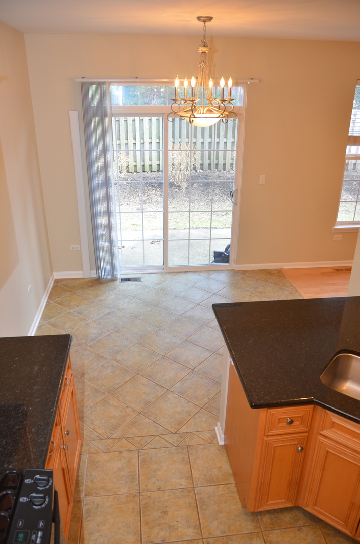 408 North River Road, Unit 408 Naperville, IL 60540 - Photo 9 of 36 a view of an empty room and window