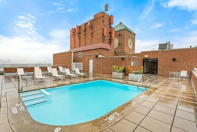 a view of a swimming pool with a lounge chairs