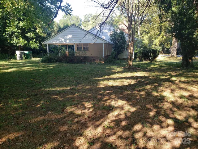 a backyard of a house with lots of green space