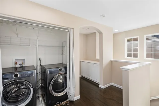a view of a storage & utility room with washer and dryer