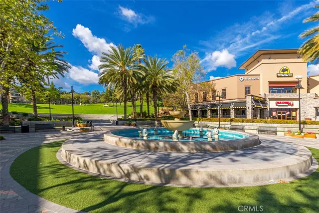 a row of palm trees in front of building