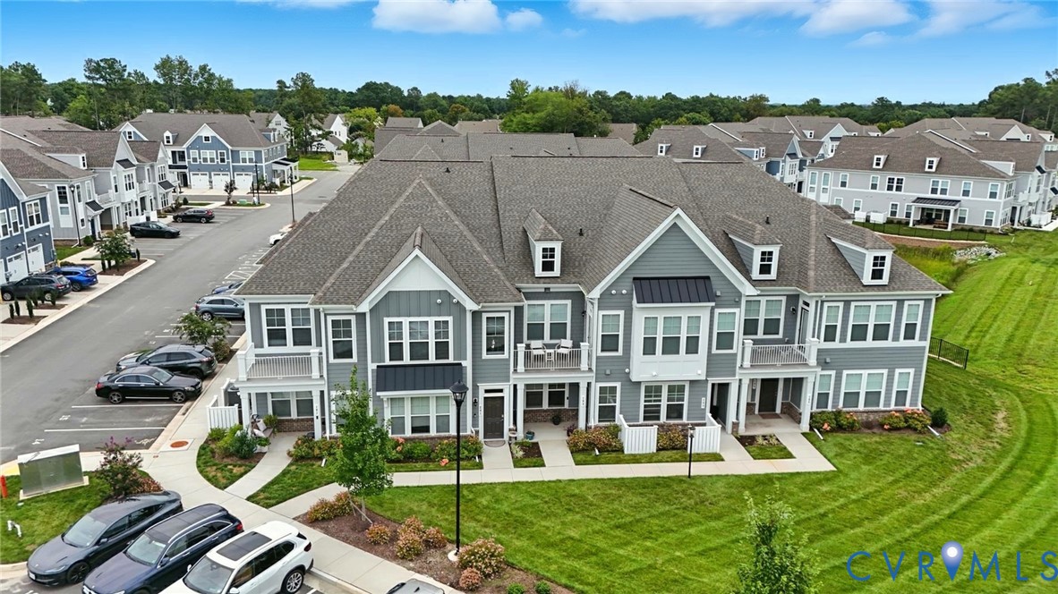 12109 Oxford Landing Drive, Unit 201 Glen Allen, VA 23059 - Photo 2 of 26 a aerial view of a house with a big yard and potted plants