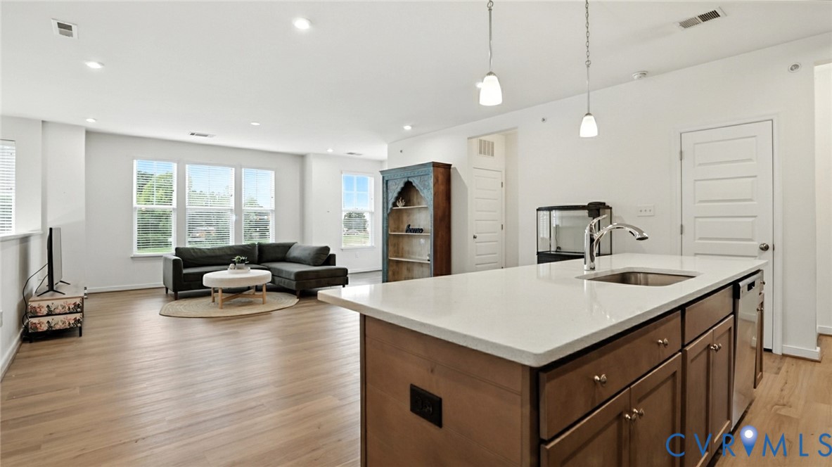 12109 Oxford Landing Drive, Unit 201 Glen Allen, VA 23059 - Photo 8 of 26 a living room with furniture and a large window