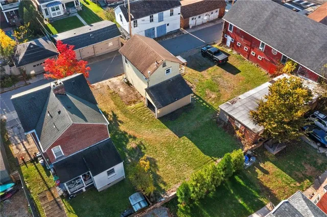 an aerial view of residential house with outdoor space