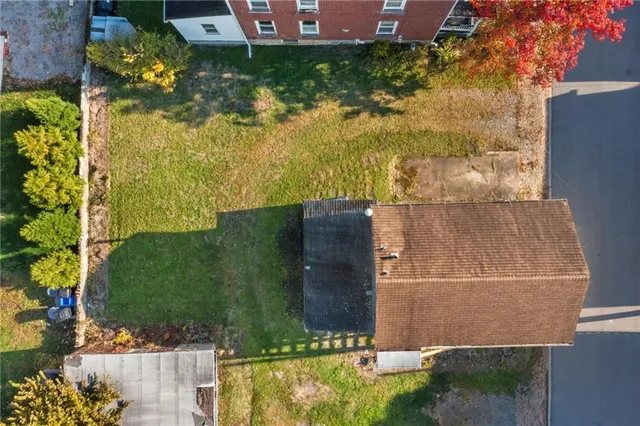 a aerial view of a house with a yard